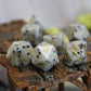 Milky Jasper dice set placed on a Dungeons & Dragons battlemap, ready for gameplay with vintage Art Deco elegance.