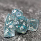 A close up image of Blue Glittery plastic dice.