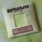 Battlecloth by Dice Dungeons packaging on a textured green background