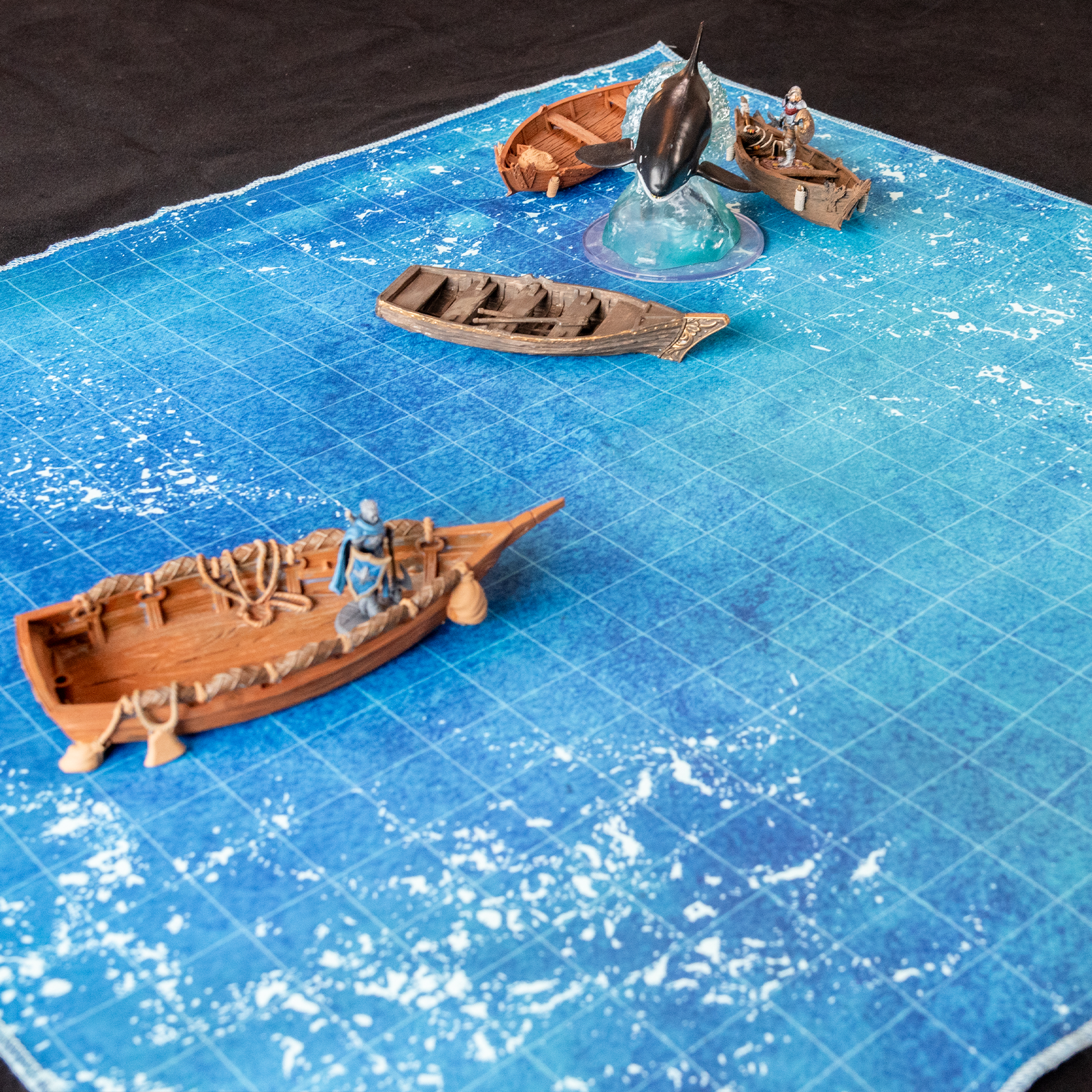 Isometric photo of an ocean battle map with multiple boat models on it