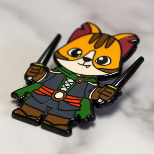 Adventure Cats rogue enamel pin featuring a cat holding a dagger, displayed against a plain white background.