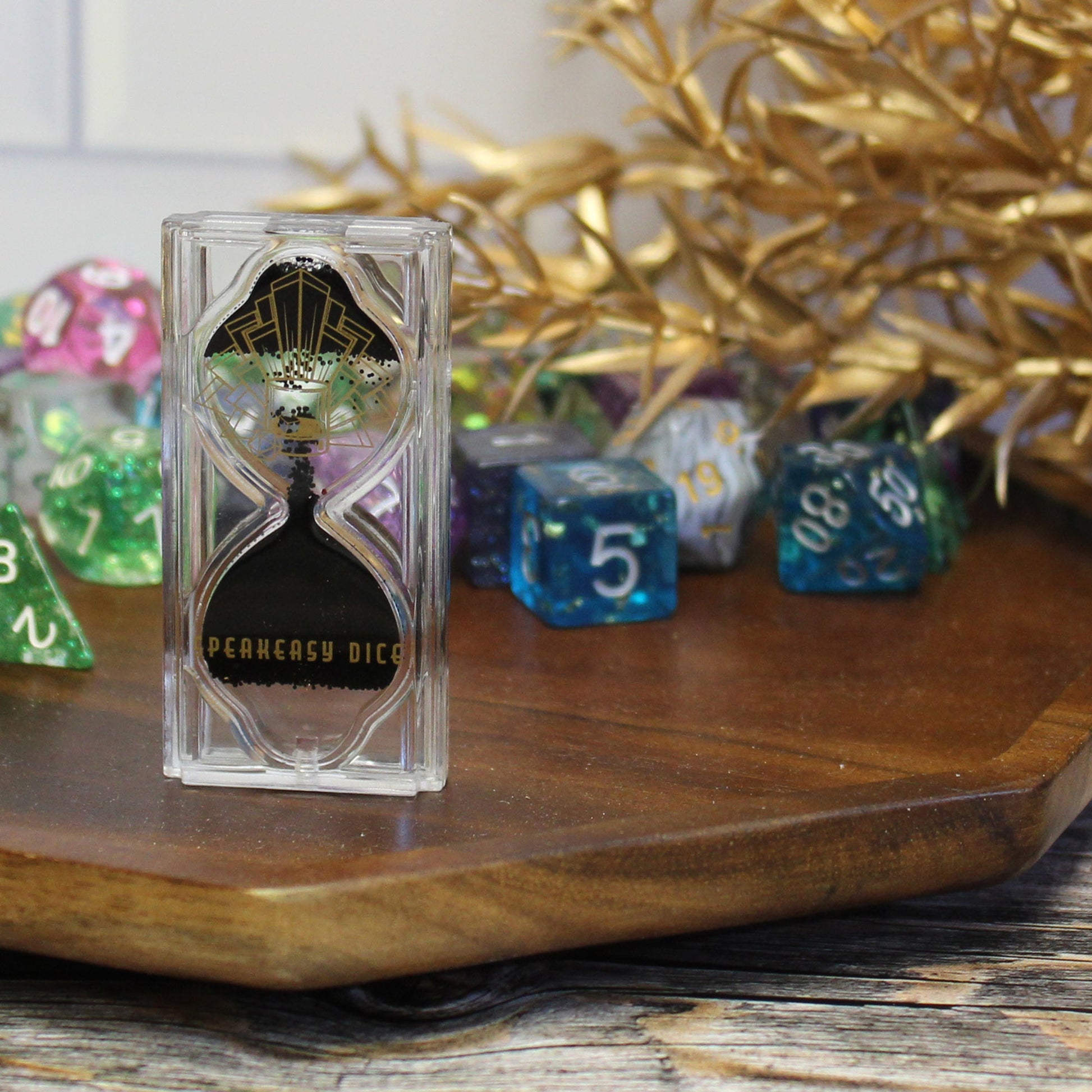 Close-up of the Speakeasy Dice Reverse Game Timer, showcasing its unique reverse countdown and art deco design, with dice sets in the background. A must-have for enhancing suspense and style during tabletop RPG gameplay.