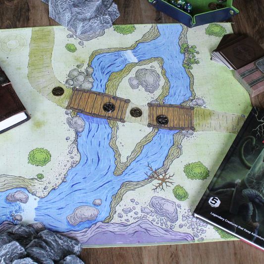 Overhead photo of a bridge battle map with metal tokens placed on it