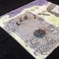 Isometric photo of a ruined temple battle map with multiple adventurers placed on it 