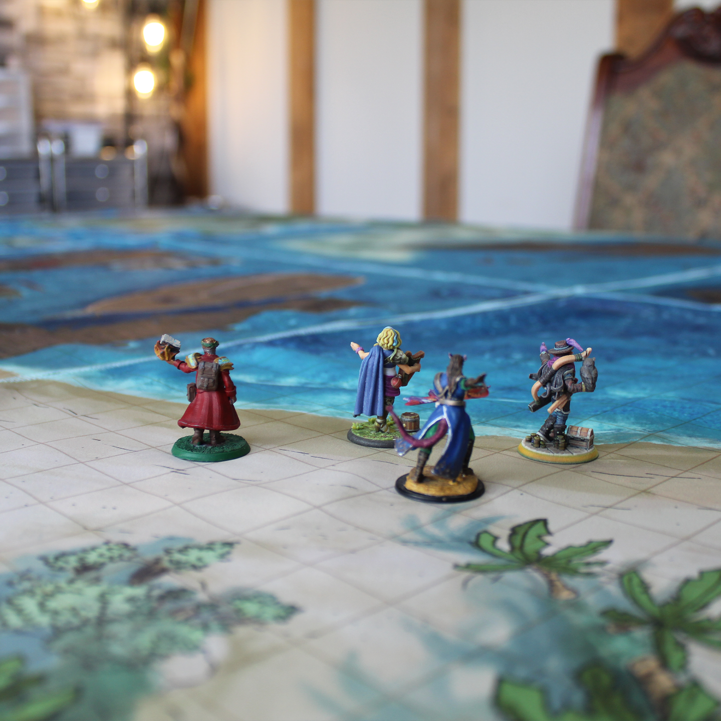 Photo of various miniature figures on a beach battle map