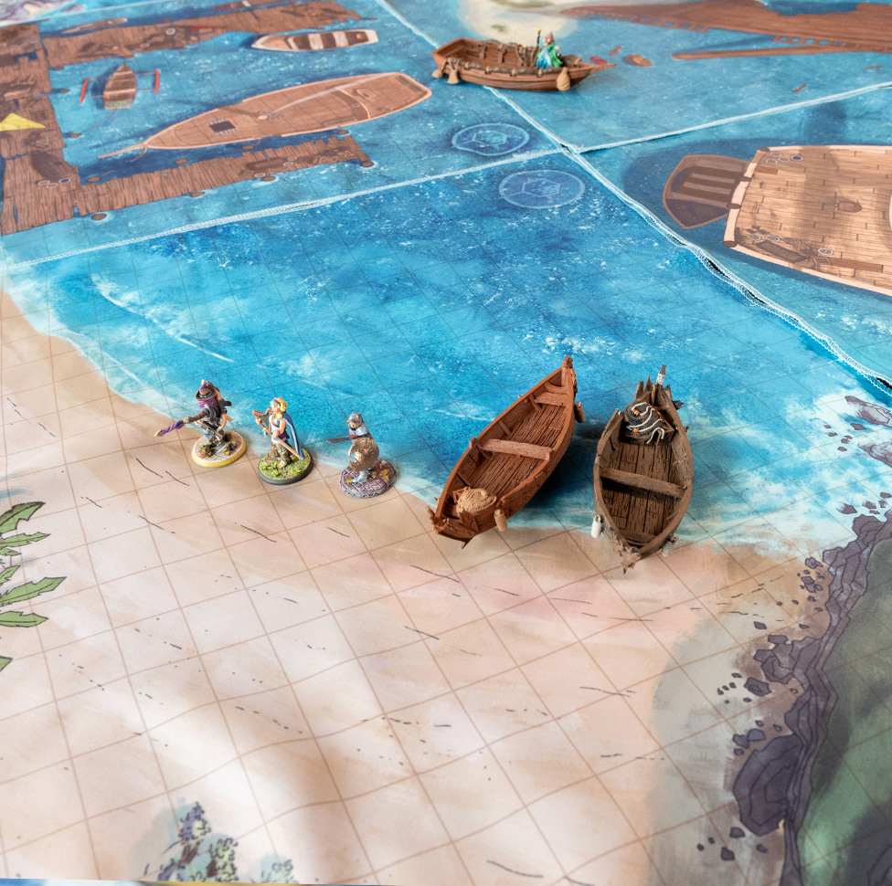 Isometric photo of a beach battle map with multiple miniature figures on it