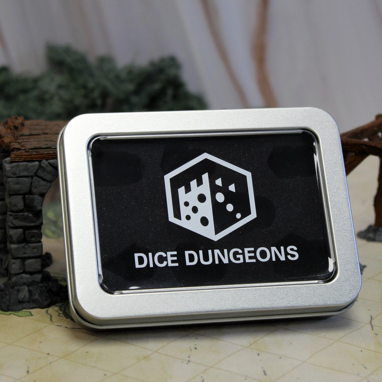 Dice Dungeons logoed tin dice box for rpg dice sets.