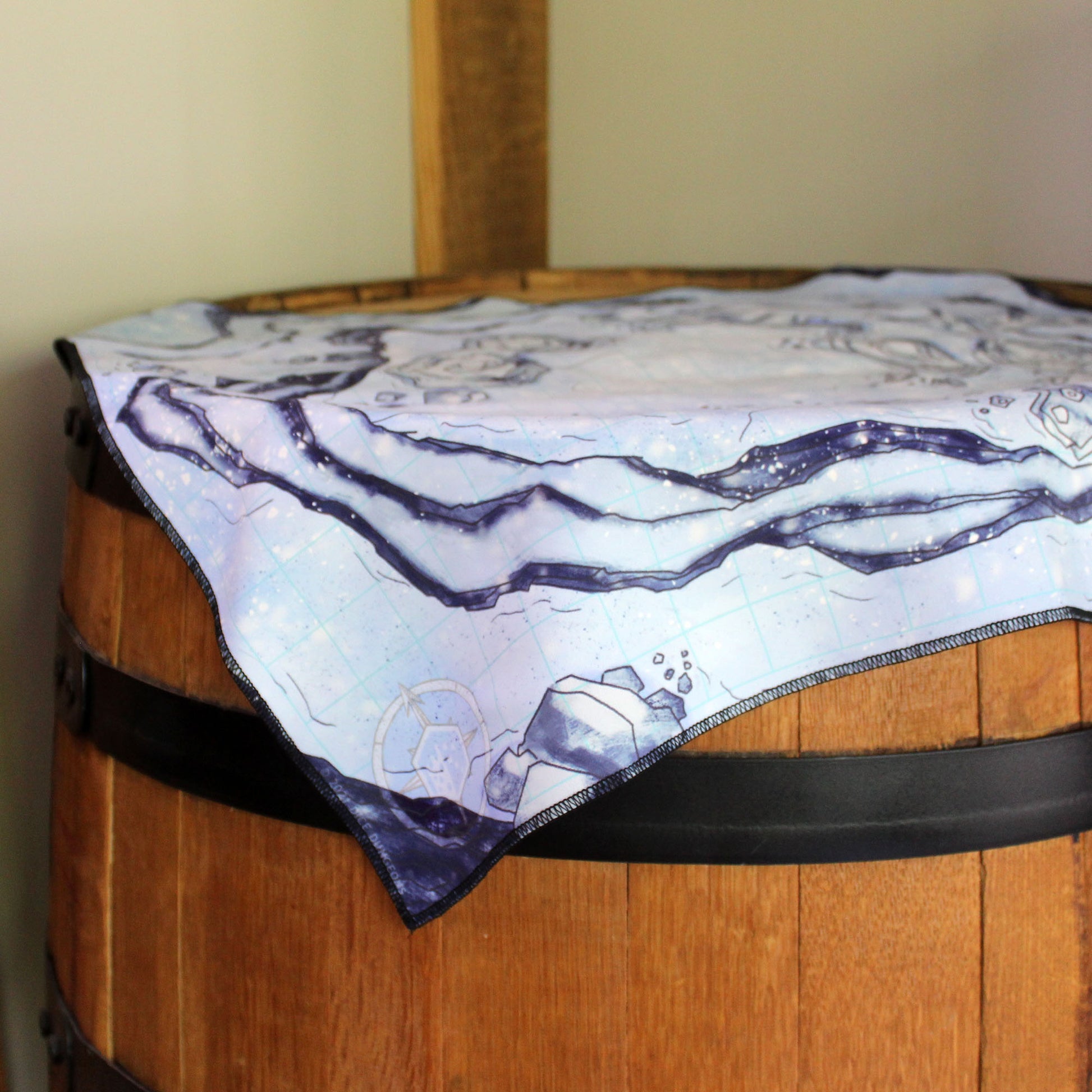 Photograph of a snowy battle map on top of a barrel