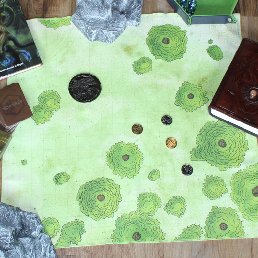 Overhead photo of a forest battle map with multiple metal tokens placed on it