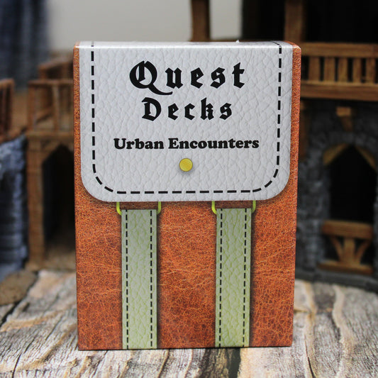 Photo of Quest Deck: Urban Encounters physical deck box standing upright on a wooden surface with miniature buildings behind it.  
Urban Encounters focuses on city secrets, the quiet streets at night, and other city encounters.