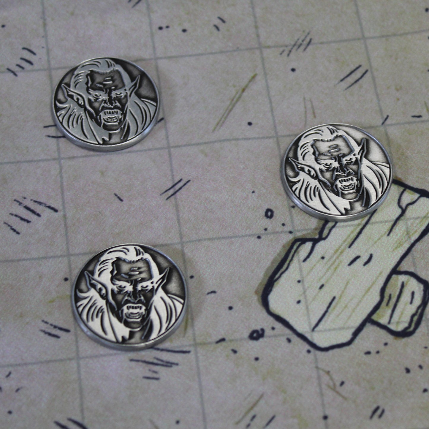 Vampire tokens on a ruined battlefield grid during a rpg game.