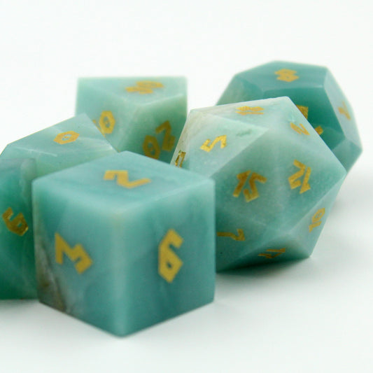 Detailed close-up of the Amazonite dice, showing the intricate gold numbering on the polished gemstone surface.