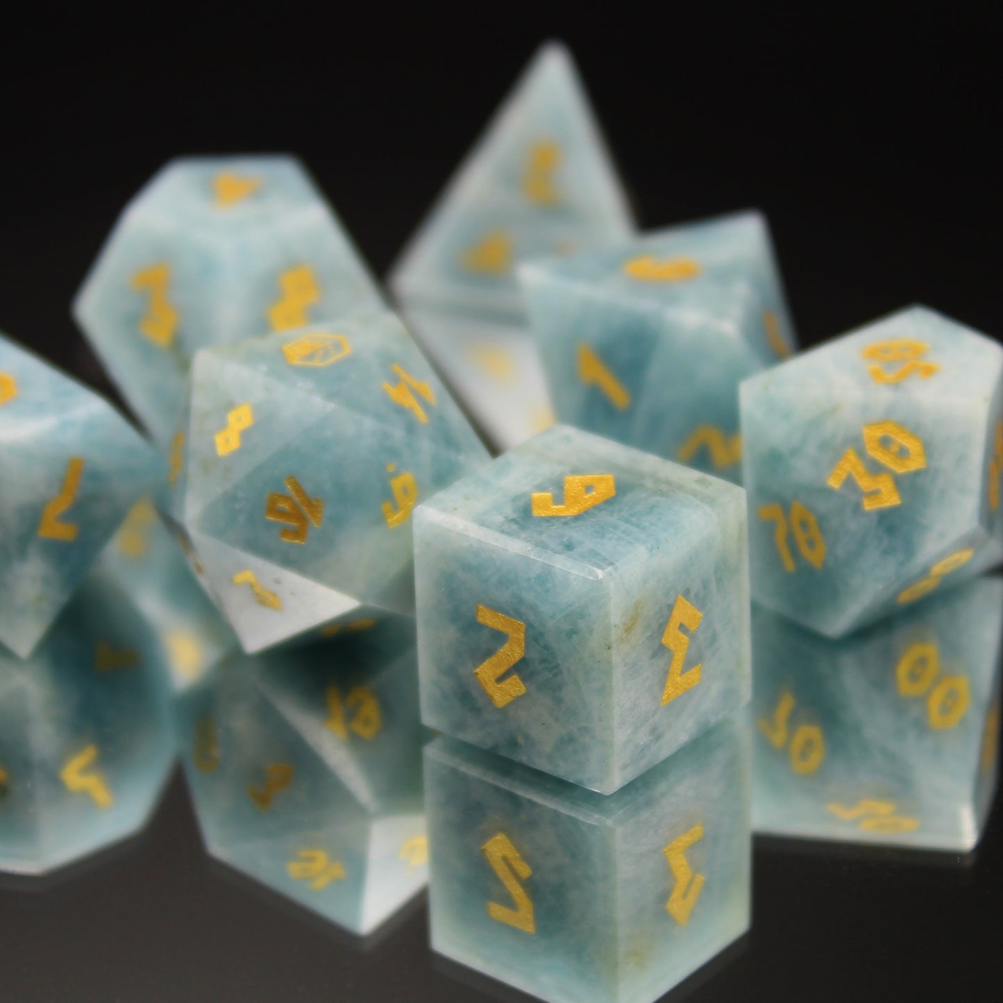 Aquamarine Dice Set on a mirror with gold font