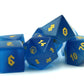 Close-up of the Cat's Eye Blue dice set, showcasing the rich deep blue color and luxurious gold numbering.