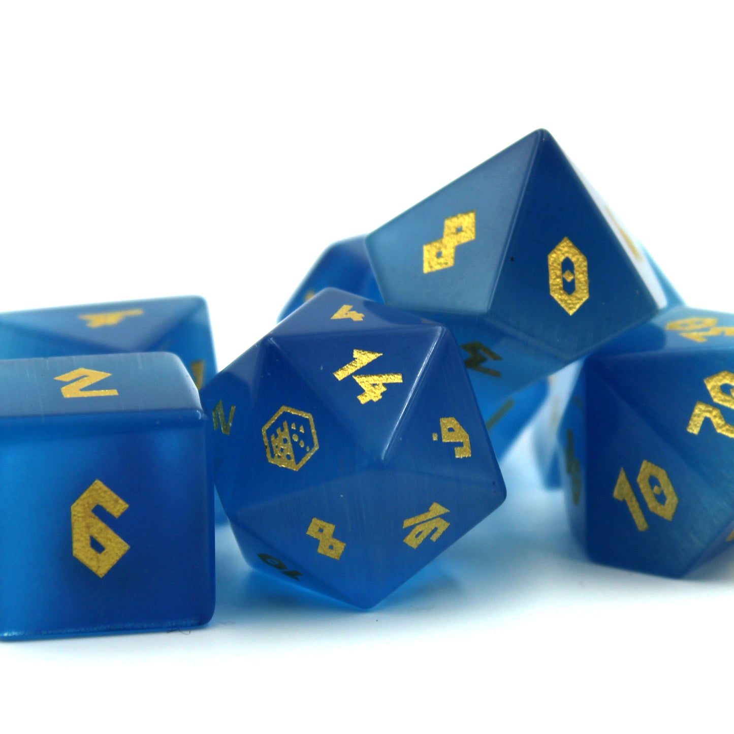 Close-up of the Cat's Eye Blue dice set, showcasing the rich deep blue color and luxurious gold numbering.