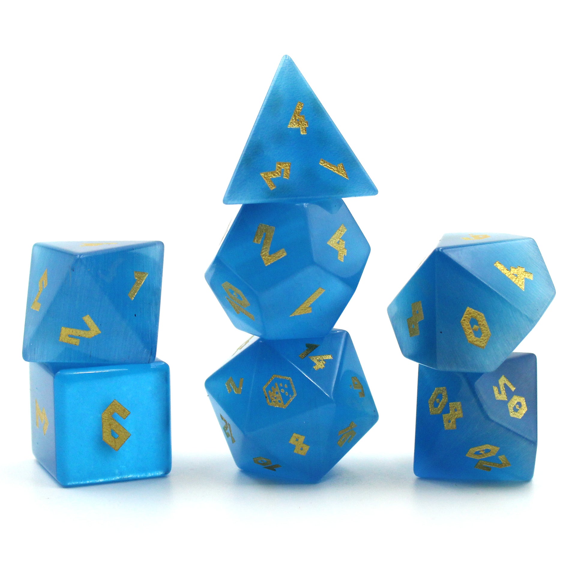 Stacked Cat's Eye Blue dice, highlighting the beautiful ombre effect from sky to deep sea blue, with gold numbering.