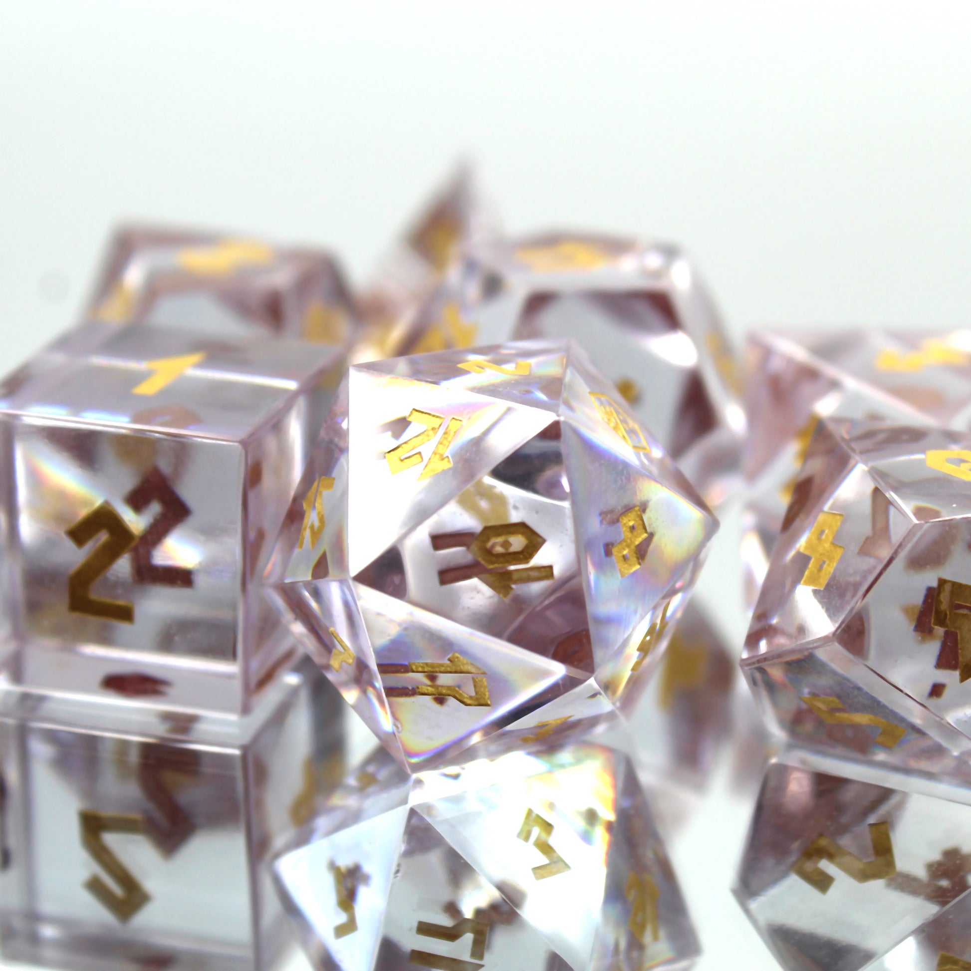 Zoomed in picture of the Cubic Zirconia dice set on a reflective surface and white background.