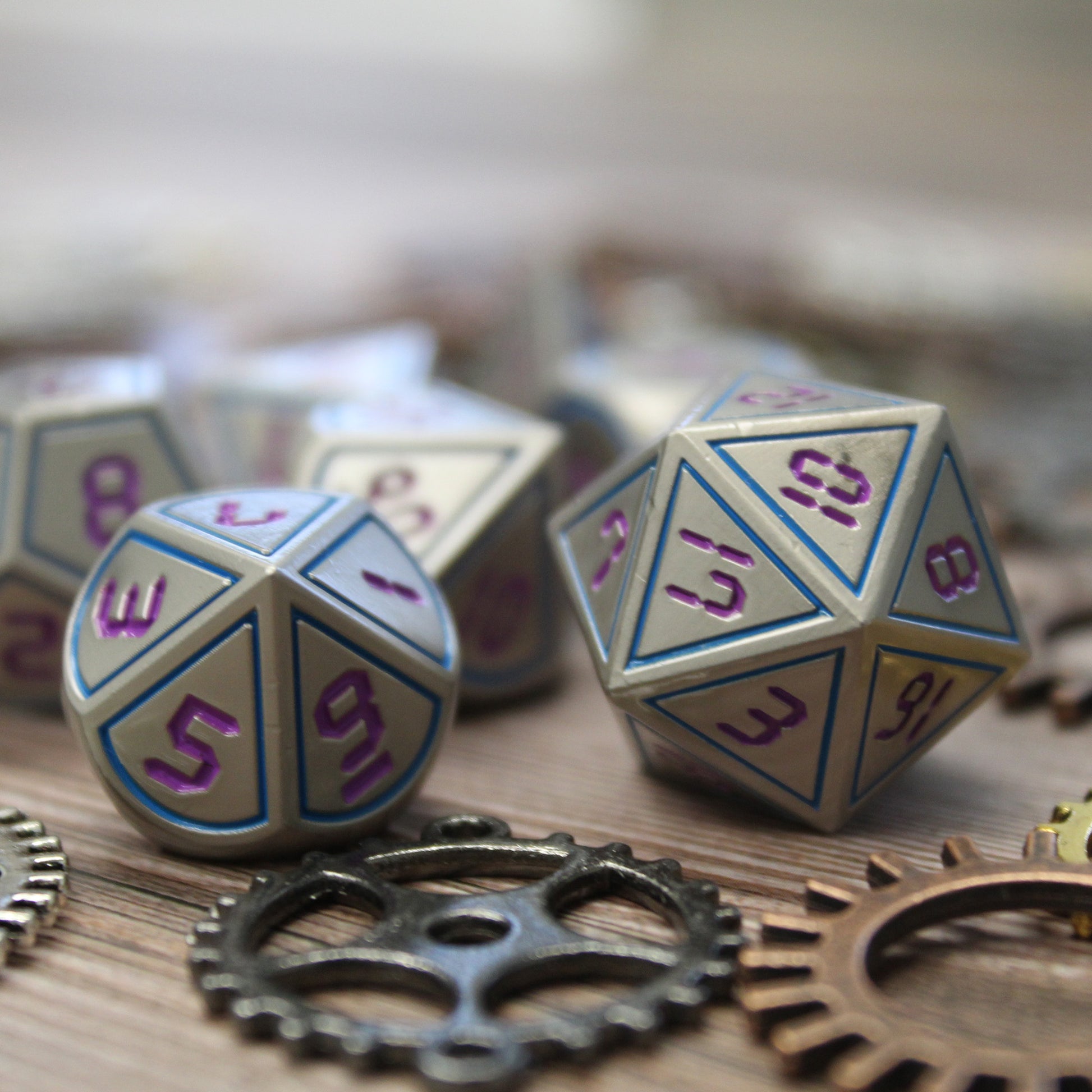 Digital font Blue and Purple metal dice set close-up.