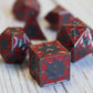 Metal DragonScale Red Dice Set on table.