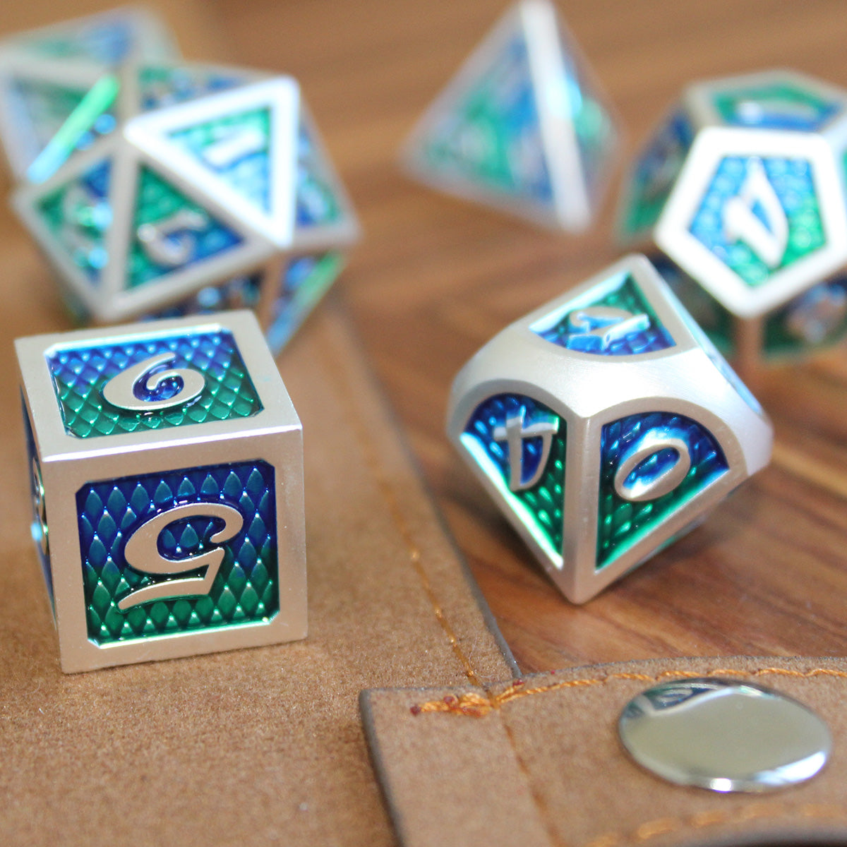 Metal Green Dice with Dragon Scales inset into it. 