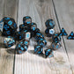 huge bundle of metal dice - black color metal with blue numbering.