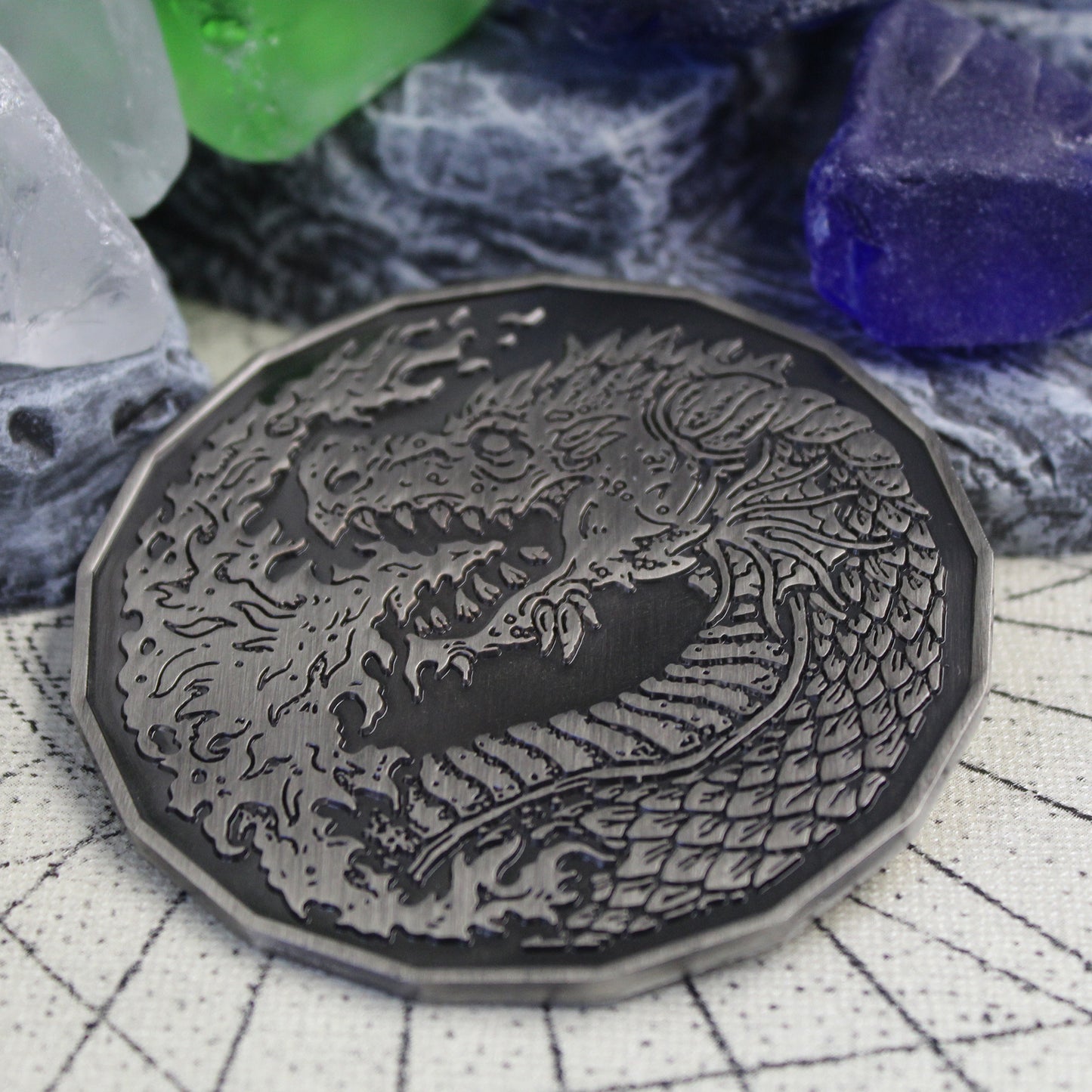 Front view of the Adult Fire Dragon token resting on a dnd tabletop.