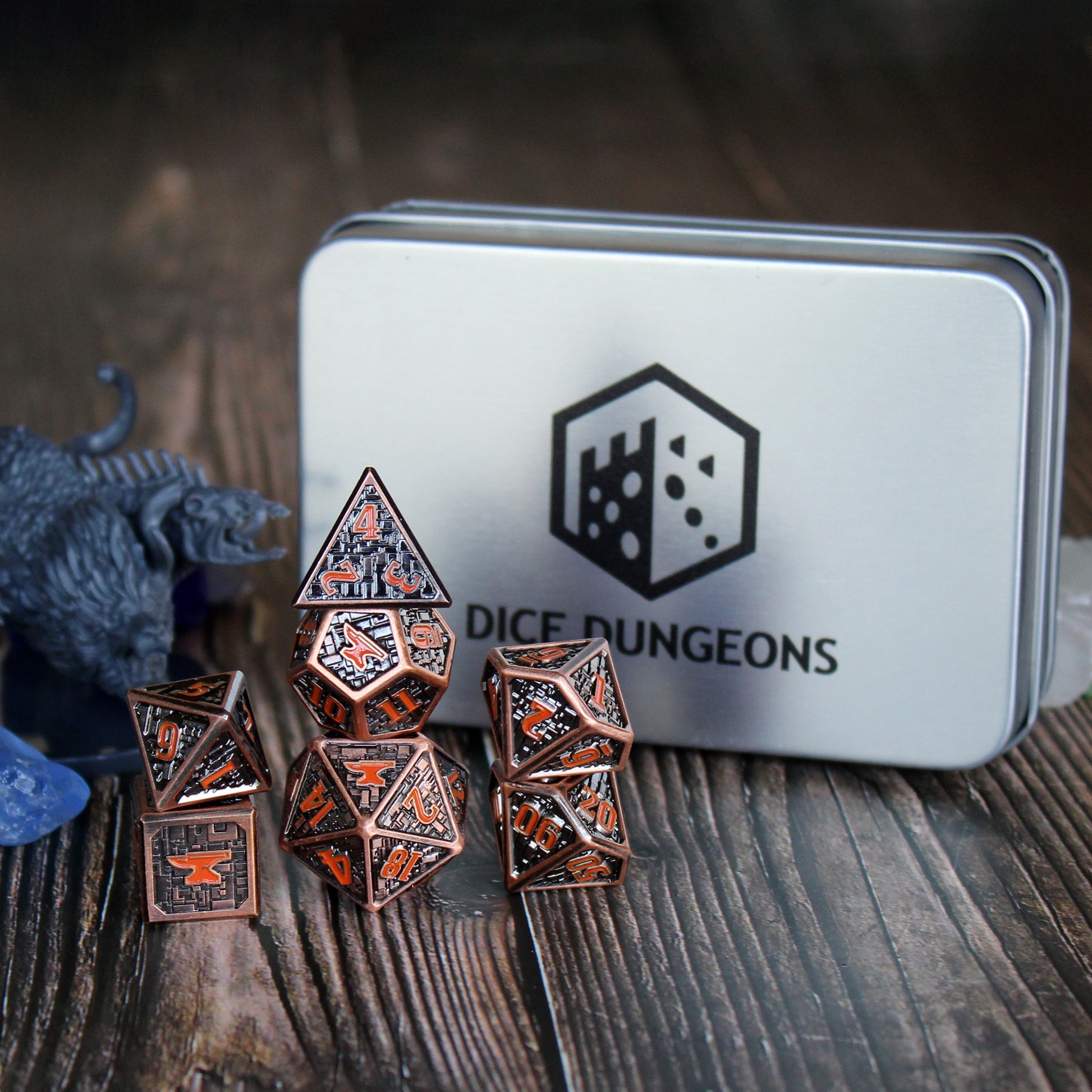 Anvil logo on the high number of the Foundry VTT Dice Set on table with included display box.