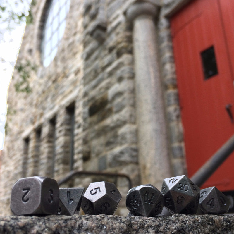Primordial Silver Dice Set Outside in-front of Church