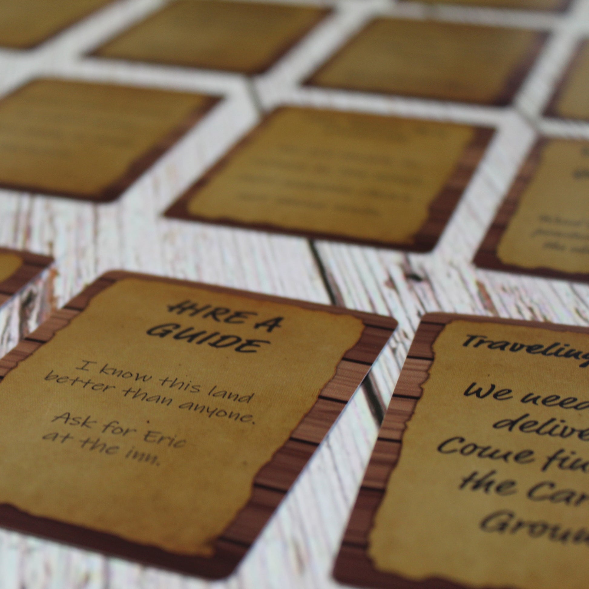 Spread of Quest Deck: The Notice Board cards laid out on a table, showcasing a variety of quest prompts for adding immersive side adventures to tabletop RPG campaigns.