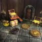 Three Rogue character tokens in both silver and gold on a battle map setting amongst treasure chests