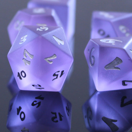 Purple sea glass dice on black