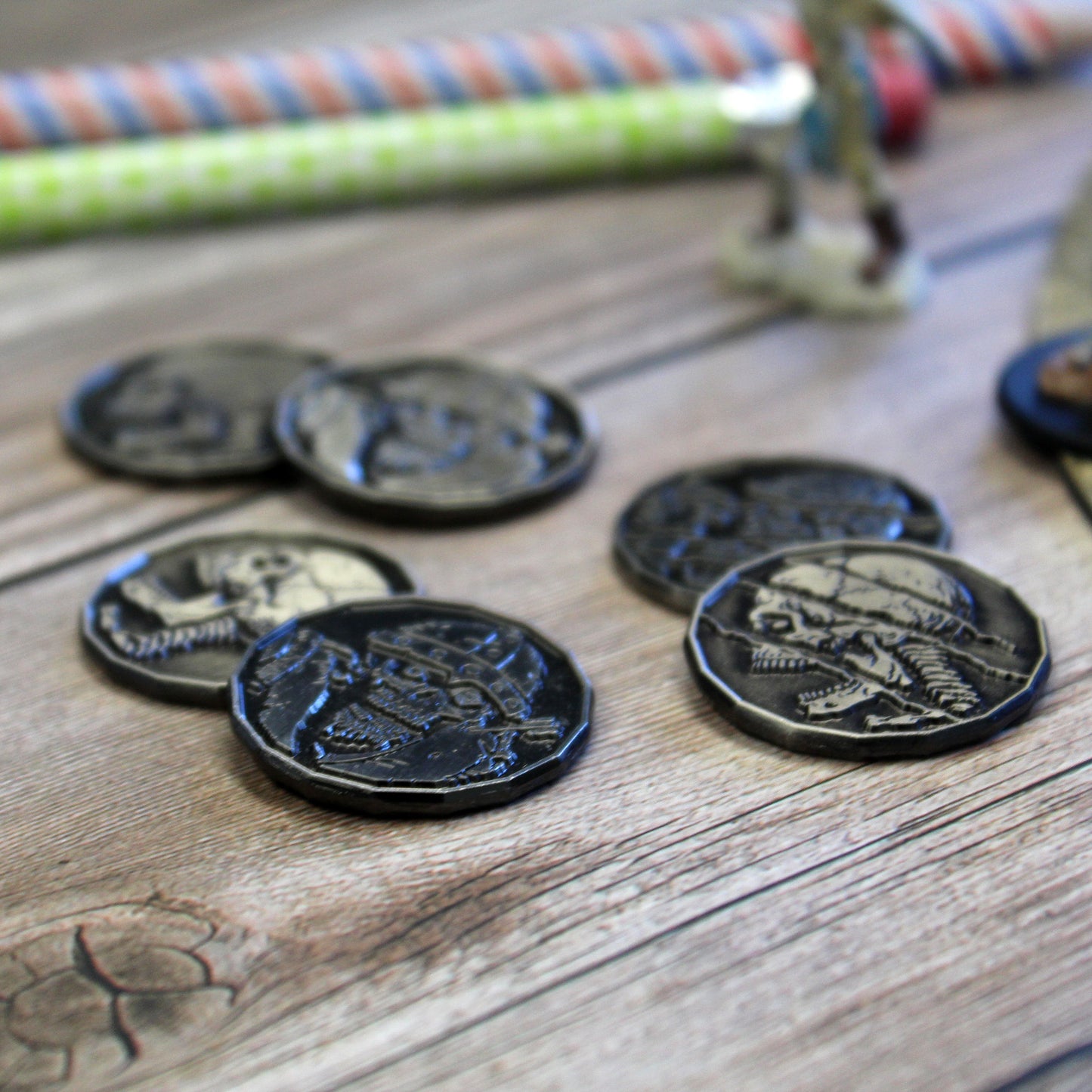 Close Up of Undead Tokens, Mix of Skeletons and Zombies, on a Wood Background