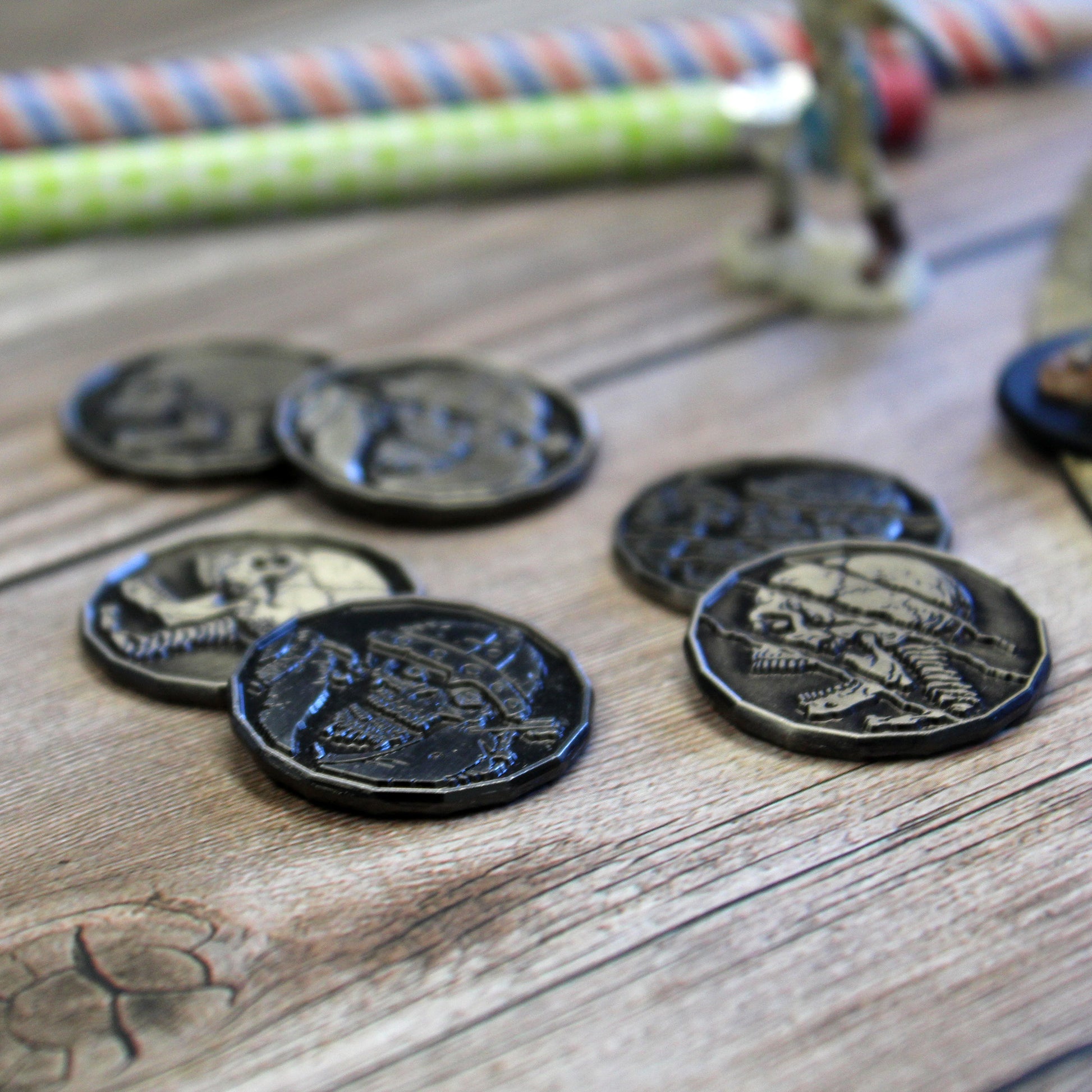 Close Up of Undead Tokens, Mix of Skeletons and Zombies, on a Wood Background