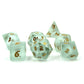 Set of Powder Blue Frosted Glass Dice with Gold Numbering Scattered on a White Background