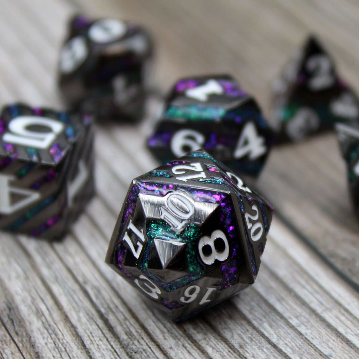 Black, Purple, and Green stripped dice set