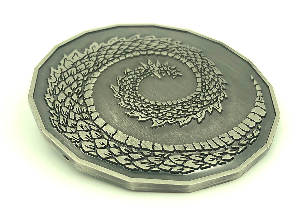 2in dragon coin on white background.  Curled tail on side facing up.