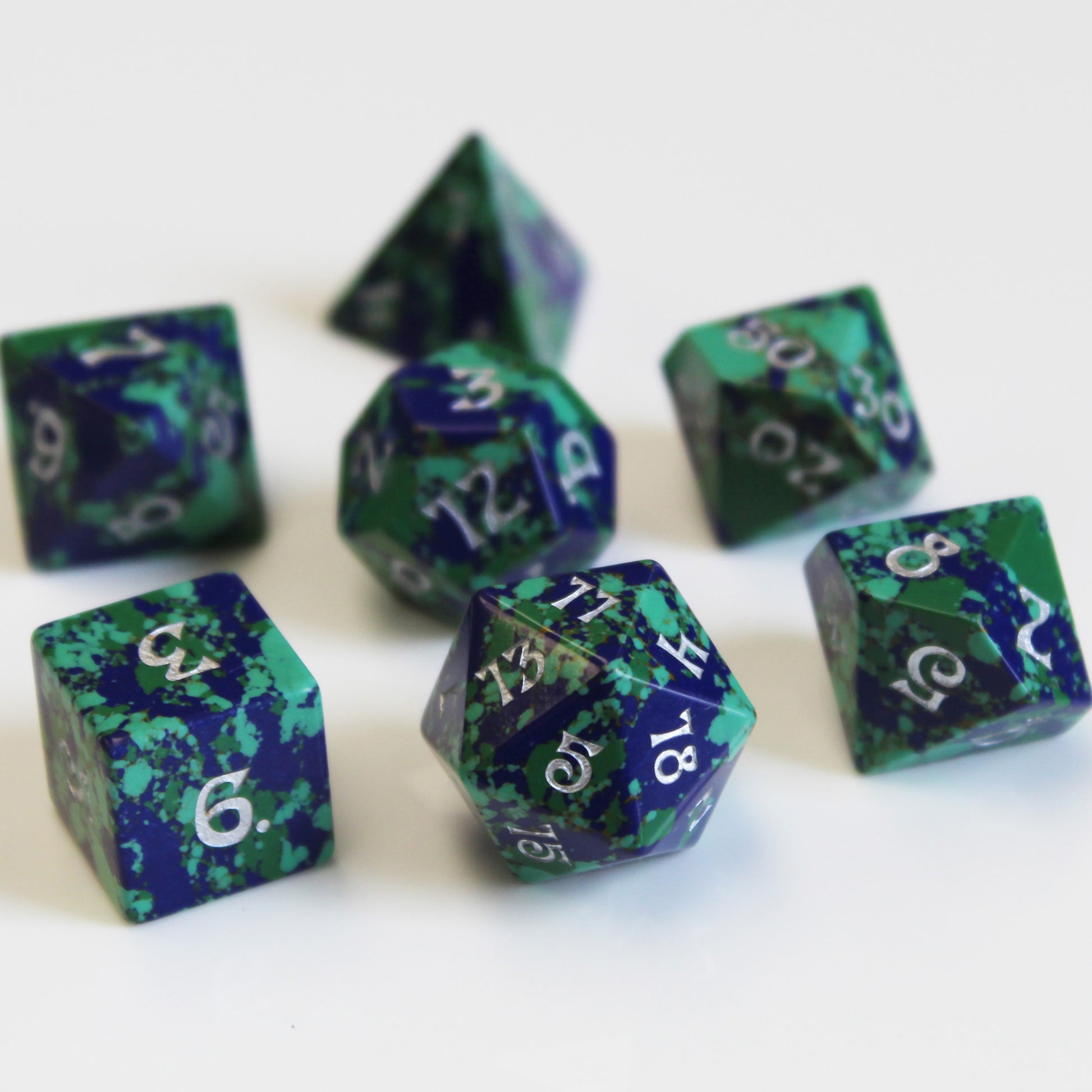 Gaia Dice Set on white background, capturing bright colors and 60s and 70s aesthetics.