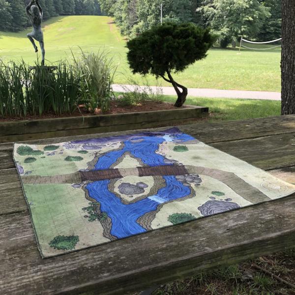 Photo of a bridge battle map on top of a picnic table